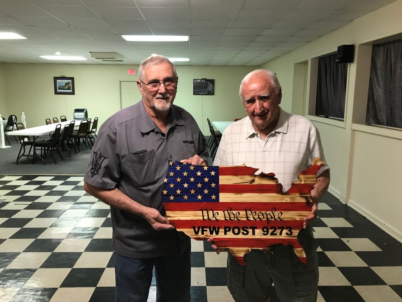 Wendell Grimes presents a gift to Commander Fowler for VFW Post 9273 in recognition of Loyalty Day.